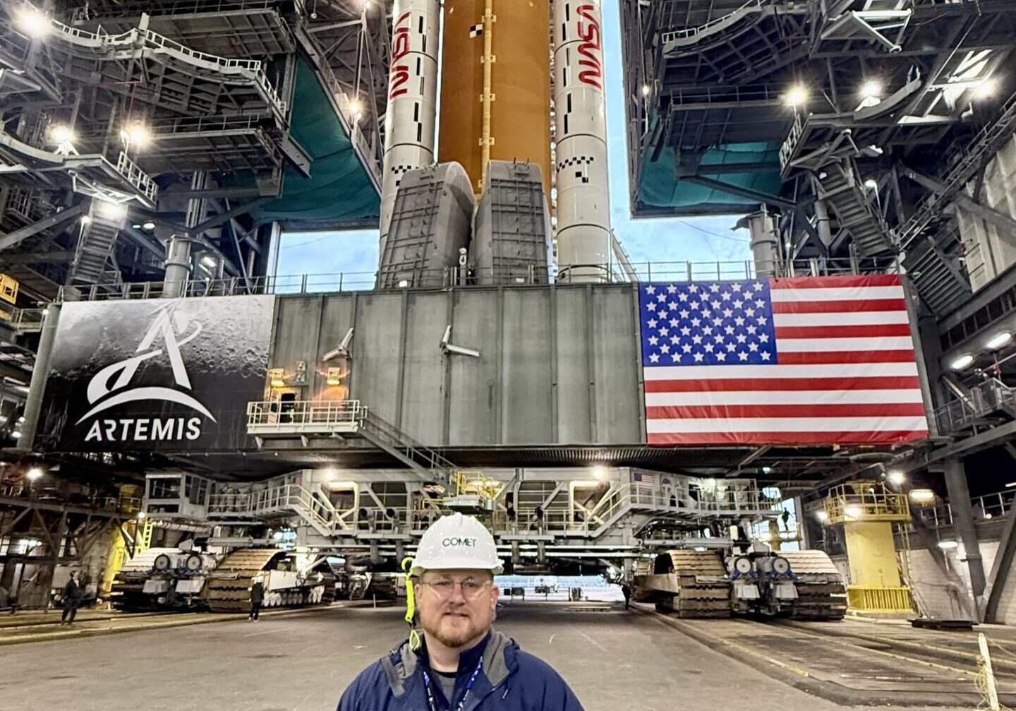 Jason Bollinger and NASA's Space Launch System (Photo Credit: Amentum)